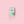 Green Energize tin with 1:1 THC and CBC mints on pink background
