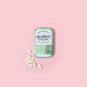 Green Energize tin with 1:1 THC and CBC mints on pink background